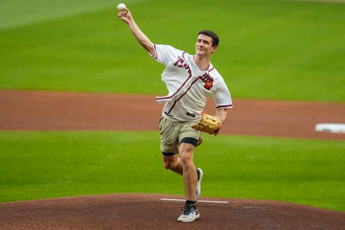 Apr 6, 2023; Cumberland, Georgia, USA; Former Georgia quarterback Stetson Bennett IV throws out the opening pitch on the field before the game between the Atlanta Braves and the San Diego Padres at Truist Park. (Dale Zanine / USA TODAY Sports).